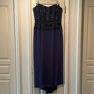 Evening gown. Color-deep purple. Slightly defined cascading train with Shaw.